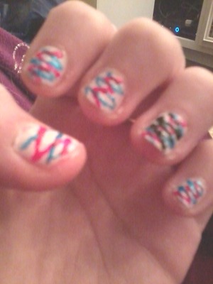 white base coat pinl and blue zig zags and black zig zag on ringfingers also