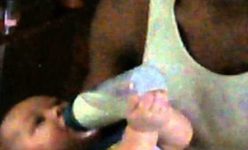 Carlo holding his bottle