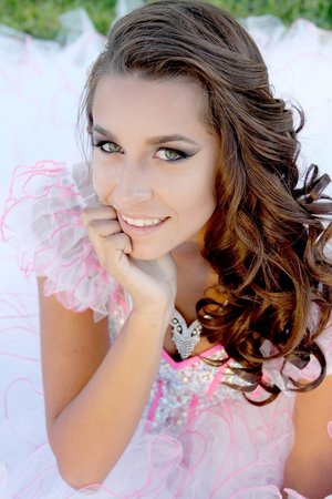 Makeup for Quinceanera photoshoot on 15 year old client. Light contour and eye makeup to bring out her green eye color