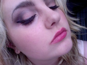 Orange smokey eye, and pink lips.