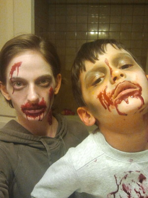Did my son and I up as zombies. Simple balck and white makeup. Home made fake skin and blood.