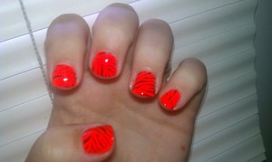 Tiger mani using Circus by Andrea's Choice Spectacle and Wet&Wild Black Creme for freehand stripes.