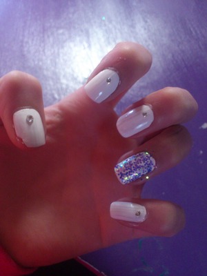 White nails with clear gems and a glitter coat:) please excuse my broken nail on my thumb:) x 