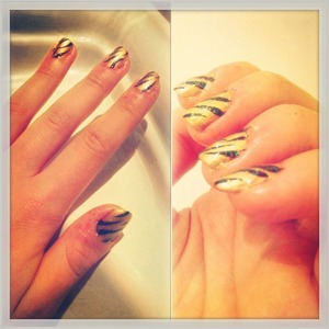Gold zebra nails with glitter 