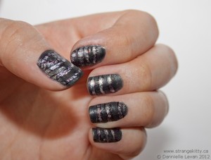 Giger inspired nails. Tutorial here:
http://strangekitty.ca/friday-nails-h-r-giger-inspired/