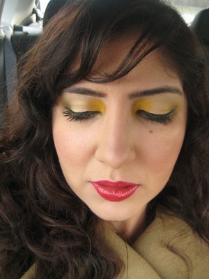 yellow eyes with metallic red lips