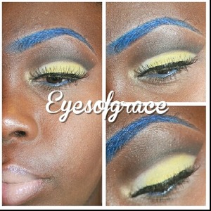 Blue brows with a yellow and black cut crease.