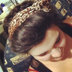 Just simple victory rolls, milkmaid braids and a headband :)