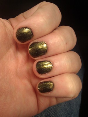 I feel like this is a really dirty gold, piratey color!
two layers of black and one layer of the gold. 
I have no idea what the gold is, it is Nicole by OPI