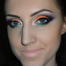 Orange, purple and green cut crease makeup