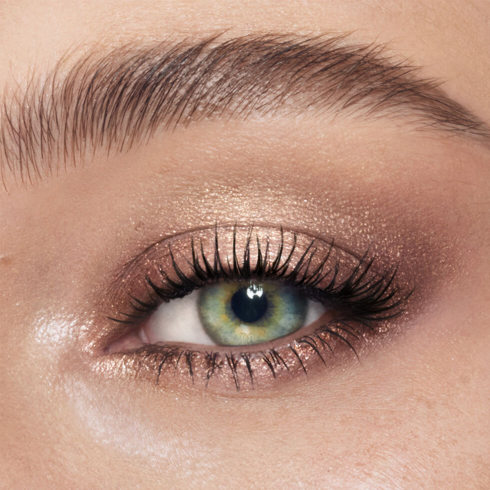 Charlotte Tilbury model wearing the Exagger-Eyes Waterproof Eyeshadow Stick in Oyster Twilight