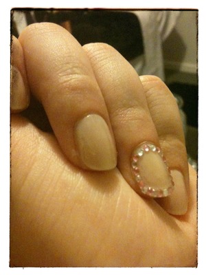 Orly sheer nude with pink and silver rhinestones.