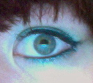 Teal eyeshadow with winged eyeliner
