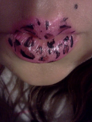 I painted those lips free style :)

Also the "Wet N Wild Silk Finish Lipstick" is in shade "522A" :)