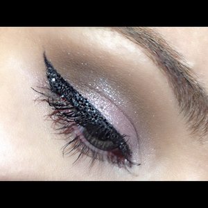 Lilac eyes and black glitter winged liner