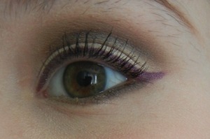 A very neutral cut crease with a pop of purple gel liner