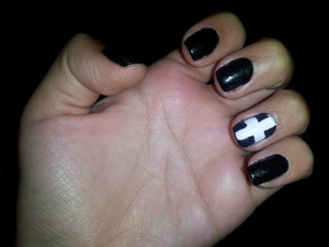 black nails with white cross.