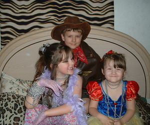 My two bundles and my step daughter (to the left). I miss these days of dress up and play....NO it was halloween we just had a little fun with some old cloths and make up....LOL