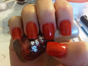 got some clear coat nail polish and just added some cheap red glitter and voila! 