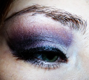 I combined lilac, dark grey, and dark reddish brown eye shadows for this look.