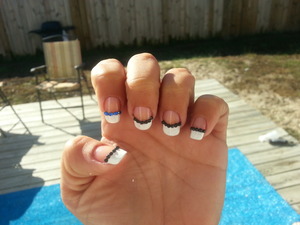 black and blue gems outlining French manicure