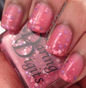 Sheer pink jelly base with pink, fuschia, and purple hex glitter and white square glitter.