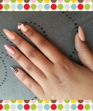 I Wanted To Try Something Different. Here, I Shaped My Nails Into The "Stiletto" Shape. Nude & Pink Are My Favorite For The Start Of Summer. Black Designs Because I'm A Little Different.