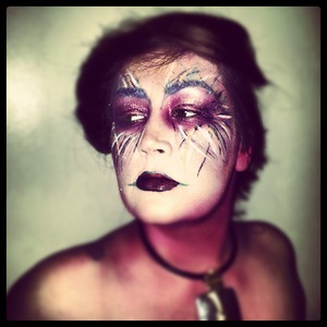 A mixture of face paint, shadows, a liquid liner make up this look I was inspired to do!
