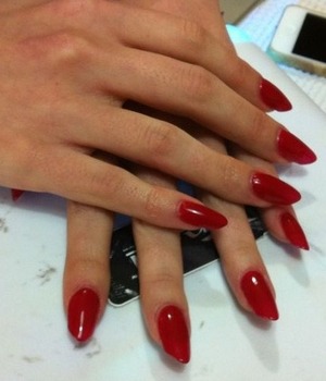 Almond/Stiletto red nails :)