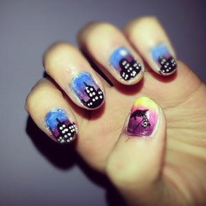 nail design inspired by cutepolish :) a city skyline with a dolphin jumping off into the sunset