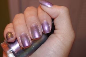 This color is a gorgeous iridescent polish that glimmers in tones of purple, grey, green and blue depending on what lighting you look at it in. It is pretty sheer, and does take about 4 coats to get at minimum opacity, but the formula is very easy to work with, so it works well. This is a near exact dupe of Deborah Lippman's Wicked Game, but for a fraction of the price. For those who love OPI's Just Spotted The Lizard, or Chanel's Peridot, this is a great option in a different tone.