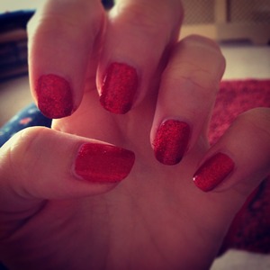 Red polish with red glitter top coat 
Blinging! 