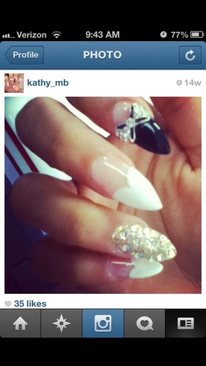 Stiletto nails with white hearts on tip , Swarovski crystals and bow