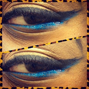 A Tad Smudged But It's Okay :) 
Still A Beginner ...
I Used ELF Day to Night 80 shadow palette, Maybeline's Gel Eyeliner in the Blackest Black for the top wing and Klean Colors Smokin Eye Shadow Creame in Electric Blue for the bottom wing :) 