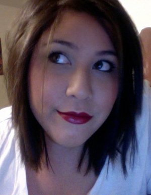 This is me playing around with red lips. I used an Yves Saint Laurent red and lined it with a dark purplish red lip liner. For the eyes I kept it as simple as I could, used a taupe eye shadow for the entire eye with white high light and then lined the eye with black eye liner and black mascara. light foundation and blush. I used a liquid foundation from sephora, the HD foundation in a medium-light, and light pink blush. :]