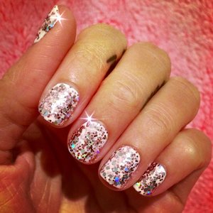 Just some glitter nails I did the other night. That glitter took 20 minutes to remove. China Glaze in White on White and a Hard Candy glitter polish. 