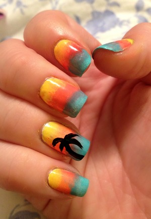 sunset-inspired gradient with a palm tree silhouette using sally hansen insta-dri in lightening & snappy sorbet, and essie sunday funday and in the cab-ana. oh, and black.