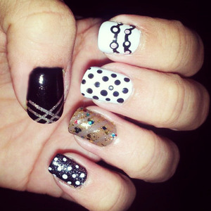 I love this style , I used black, white and brown polish. dotting and striping tape :D