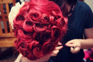 Red hair in a pincurl updo done my me for a photoshoot. 