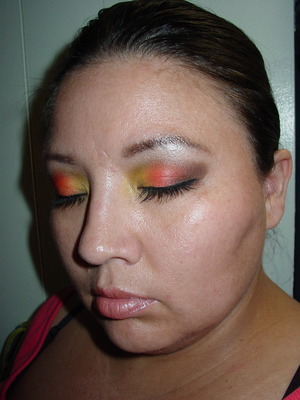 close up 
inner third of eyelid is a mate yellow taxi from Mark new palette superflip . 
middle of eyelid is orange from trio Shangri-la from NYX
outter eyelid is  M.I.A.  a deep chocolate brown from the new Urban Decay 15 year anniversary palette
inner c