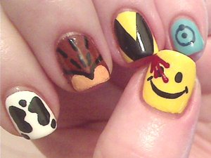 My nerdy side shining through with a Watchmen mani,  Used mostly acrylic paints over a base of polish here. Hard Candy Splendid for the yellow and NYC French White for the White bases