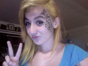 HOW TO: I took a black eyeliner, and then drew multiple c-like shapes, o-like shapes, and dots. To finish it off i did a cat eye and brushed glitter over it.
SOO YEAH.