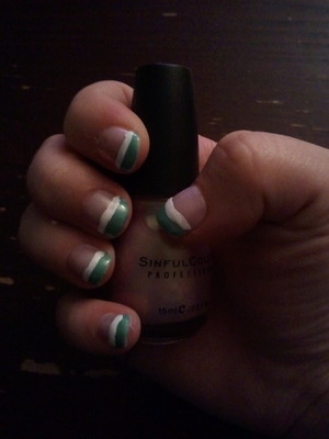 my first attempt at some kind of nail art. Used Sinful Colors for the polish: Mint Apple for the tips, Just You Wait for the nail, and Bad Chick to separate the two. I know...a bit messy, but i'm pretty proud of my handy work :)
