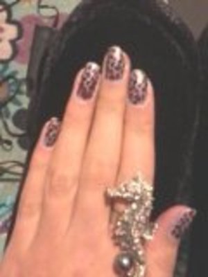 NYE Leopard Print Nails to Match my Nicole Miller Leopard Coat Dress.
OPI Sheer Your Toys Base.
Konad Special Polish in Black for Leopard Design.
OPI 25 Years For Accent in Leopard Design.