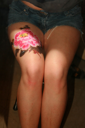 Mirror image of the flower on my leg.