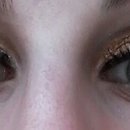 gold and brown eyeshadows and false eyelashes