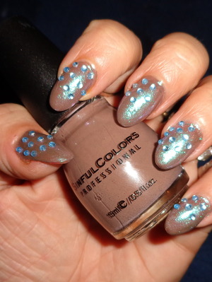 dirt brown polish with a white sparkle and some random blue stones....equals awesome