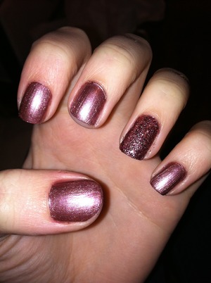 A pretty copperish color with sparkles on the ring finger. 