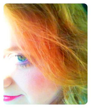 Liked this picture of my green eyes against my red hair set off by the sunlight.  Hint of my hot pink lipstick at the bottom.