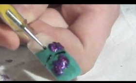 Purple Glitter Bat Nail Design